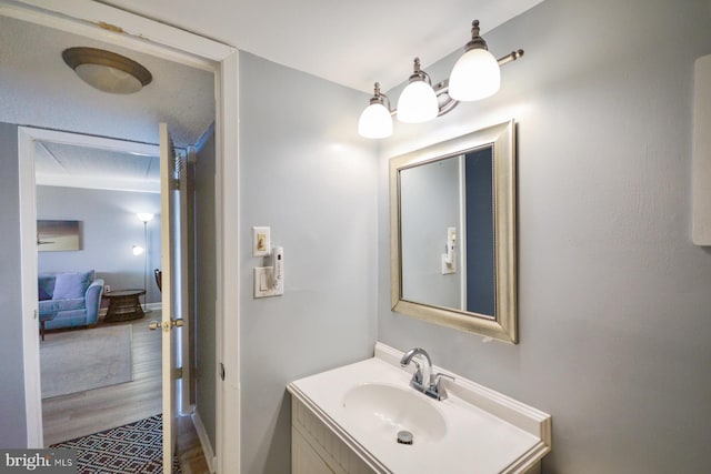 bathroom featuring vanity and hardwood / wood-style flooring