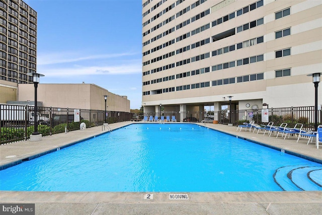 view of swimming pool with a patio