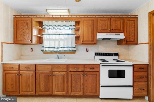 kitchen with white electric range, light tile patterned floors, and sink