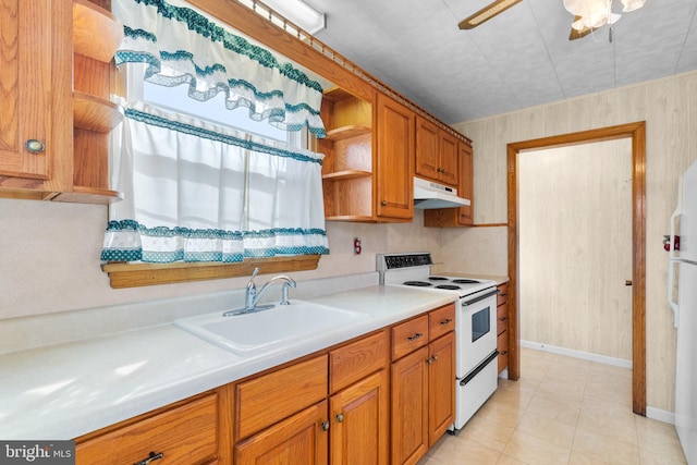 kitchen with ceiling fan, sink, light tile patterned floors, and white appliances