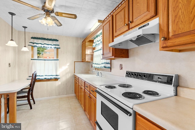 kitchen featuring ceiling fan, sink, decorative light fixtures, and white electric range