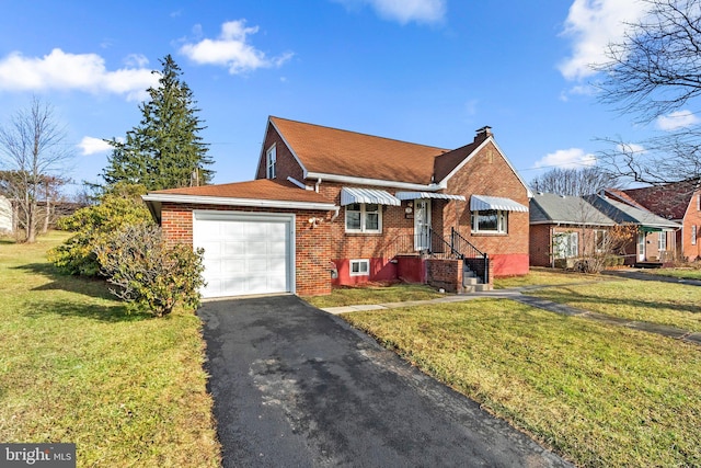 view of front of property with a garage and a front yard