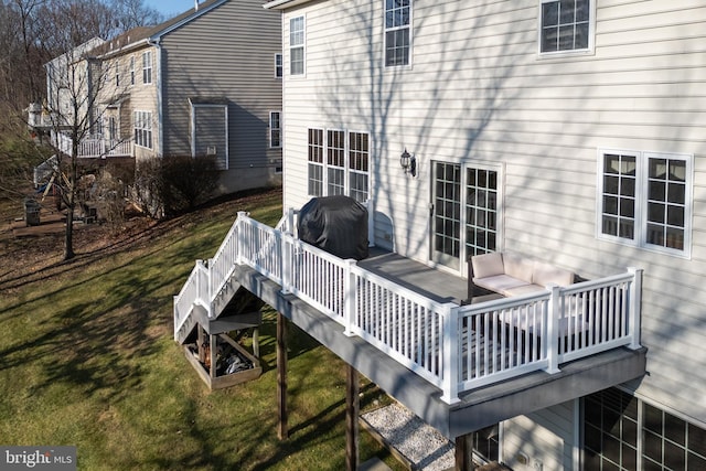 deck with a lawn and a grill