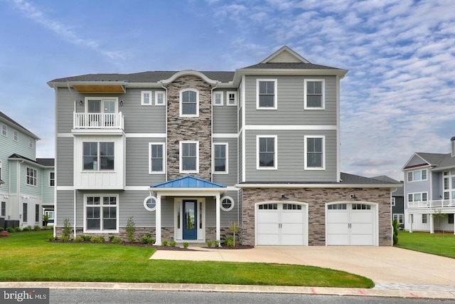 view of front of house featuring a front yard and a garage