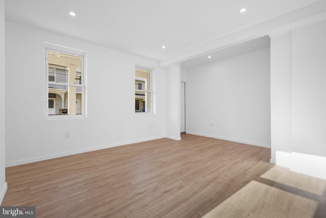 spare room featuring light hardwood / wood-style floors