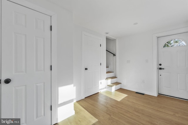 entryway with light hardwood / wood-style flooring