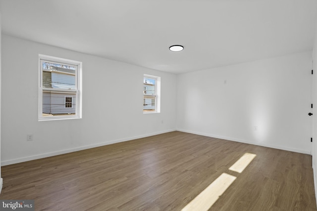 empty room featuring wood-type flooring