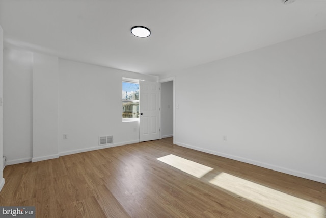 empty room featuring light hardwood / wood-style floors