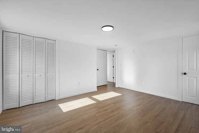 unfurnished bedroom featuring hardwood / wood-style floors