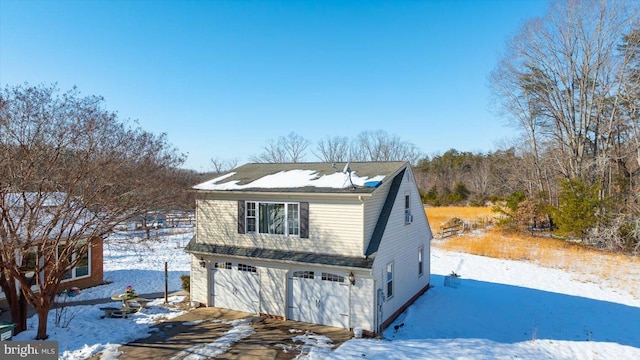 front of property with a garage