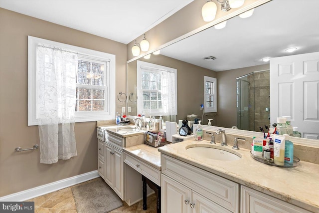 bathroom featuring walk in shower and vanity