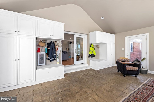 mudroom featuring vaulted ceiling, dark wood-type flooring, and french doors