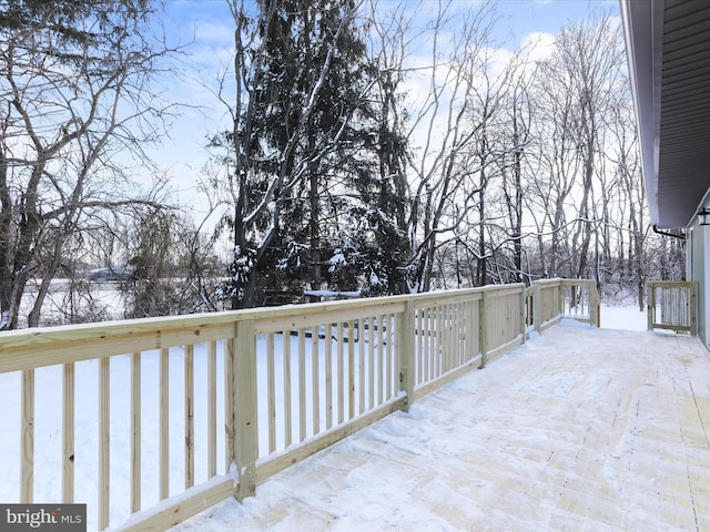 view of snow covered deck