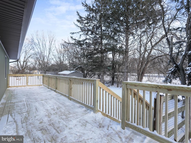 view of snow covered deck