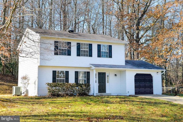 view of front of property with cooling unit, a garage, and a front yard