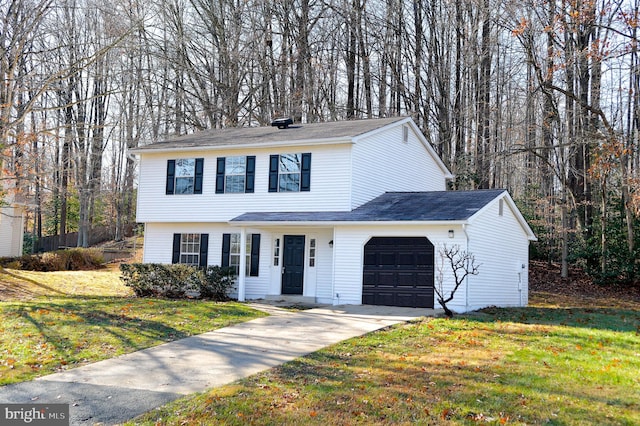 view of front of house with a front lawn and a garage