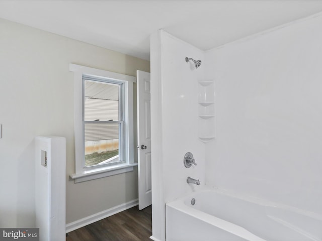 bathroom with shower / tub combination and wood-type flooring