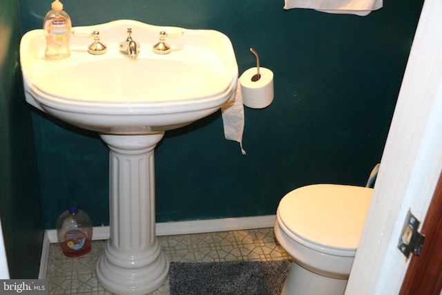 bathroom with tile patterned floors and toilet