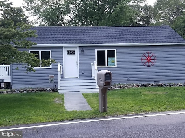 view of front of property with a front lawn