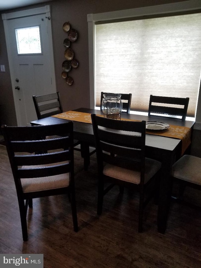 dining area featuring dark hardwood / wood-style floors