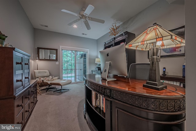 office area featuring light carpet and ceiling fan