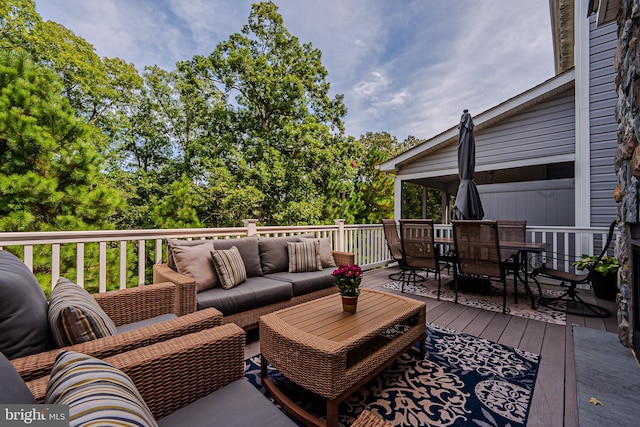 wooden terrace with outdoor lounge area