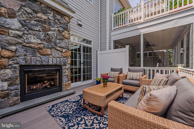 deck featuring an outdoor living space with a fireplace