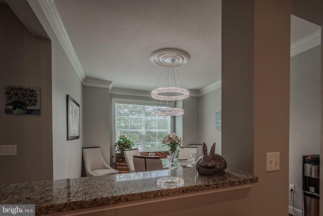 dining area featuring a chandelier and ornamental molding