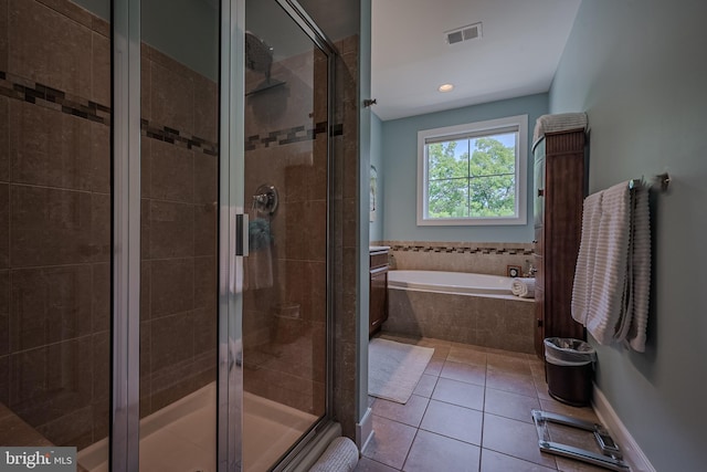 bathroom featuring tile patterned flooring and independent shower and bath