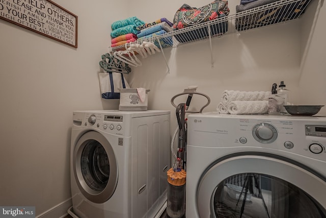 laundry area with washing machine and dryer