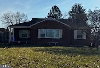 view of side of property featuring a yard