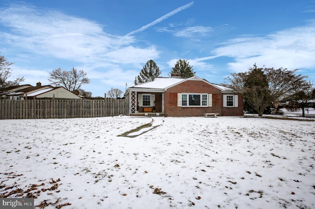 view of snow covered house