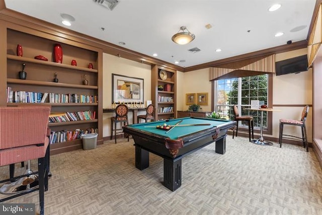 game room featuring built in shelves, light colored carpet, ornamental molding, and billiards