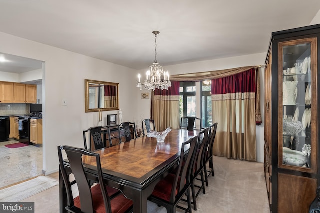 dining area with light carpet and a notable chandelier