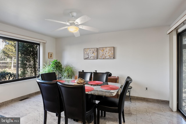 dining room featuring ceiling fan