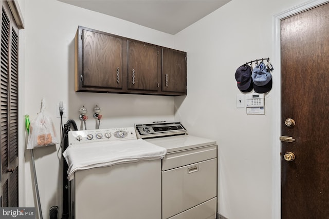 laundry area with cabinets and independent washer and dryer