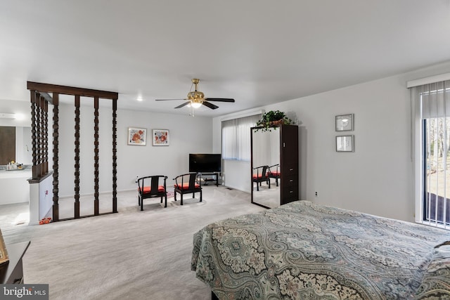 bedroom with light carpet and ceiling fan