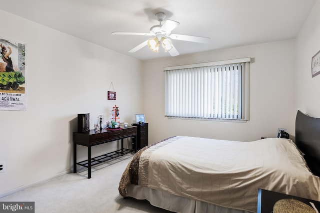 bedroom featuring ceiling fan and light colored carpet