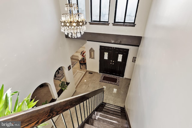 entrance foyer with an inviting chandelier