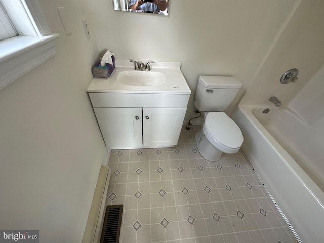 bathroom with tile patterned floors, vanity, and toilet