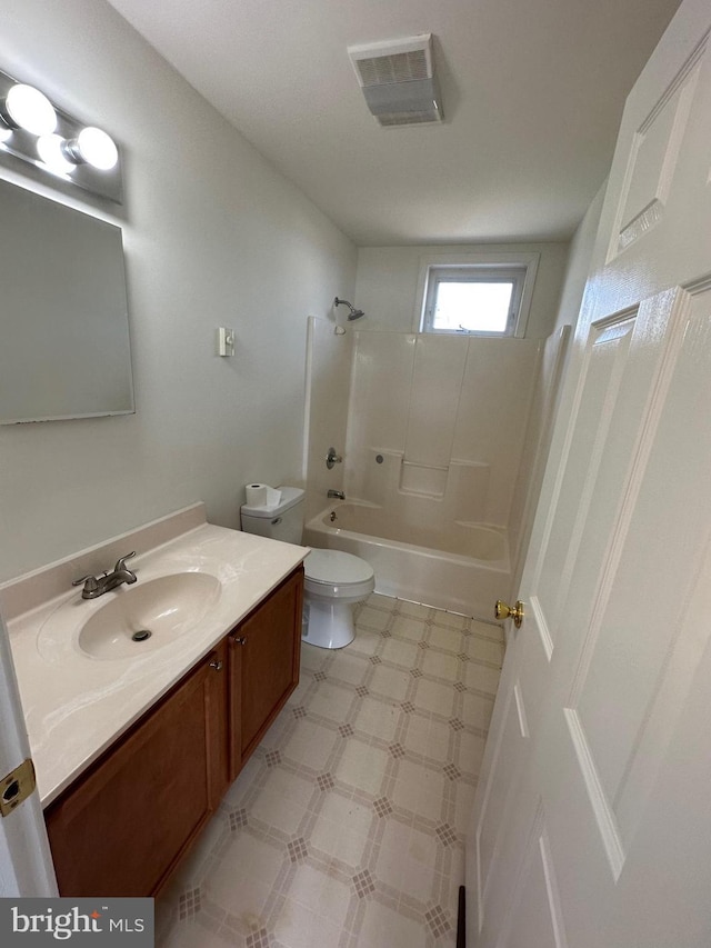 full bathroom featuring toilet, vanity, and washtub / shower combination