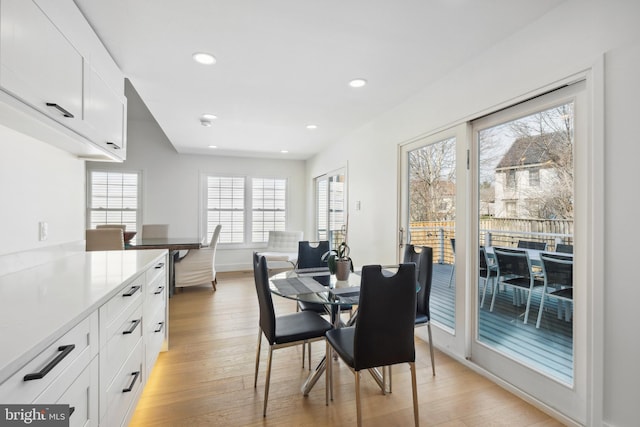 dining area featuring recessed lighting, light wood-type flooring, and baseboards