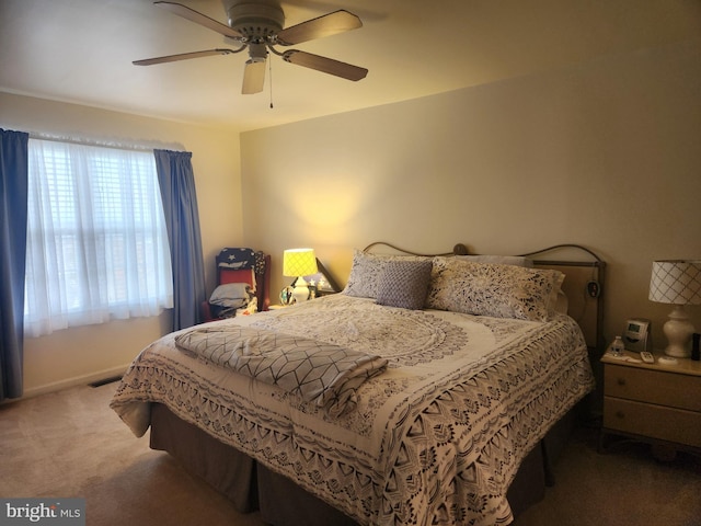 bedroom with ceiling fan and carpet floors