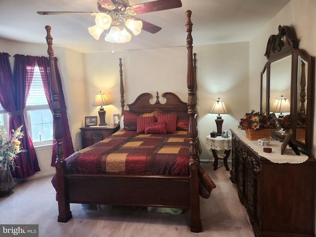 bedroom with ceiling fan and light carpet