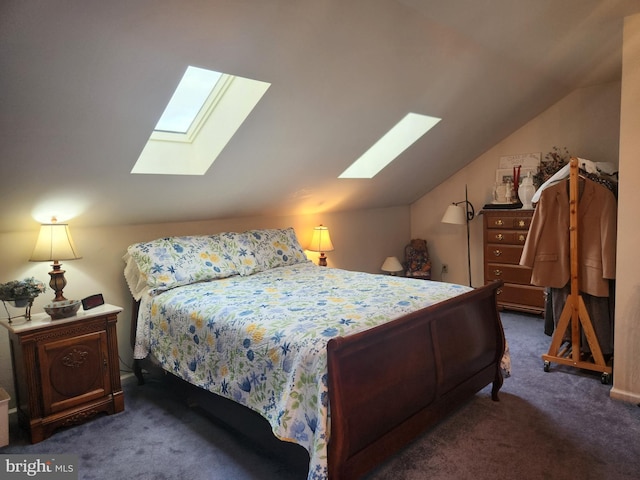 bedroom featuring lofted ceiling with skylight and dark colored carpet