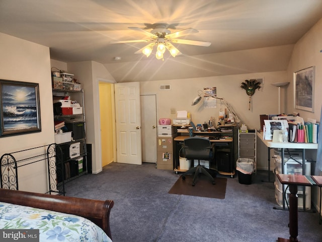 bedroom with dark colored carpet, vaulted ceiling, and ceiling fan