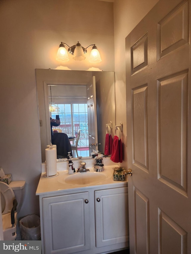 bathroom with vanity and toilet