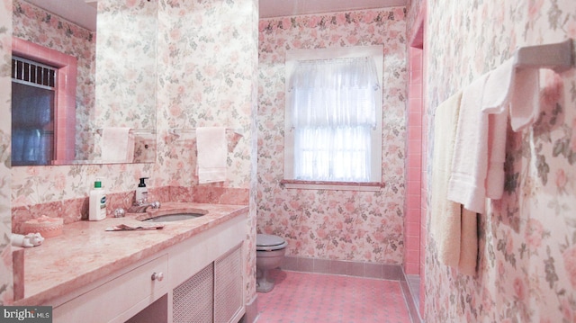 bathroom with vanity and toilet