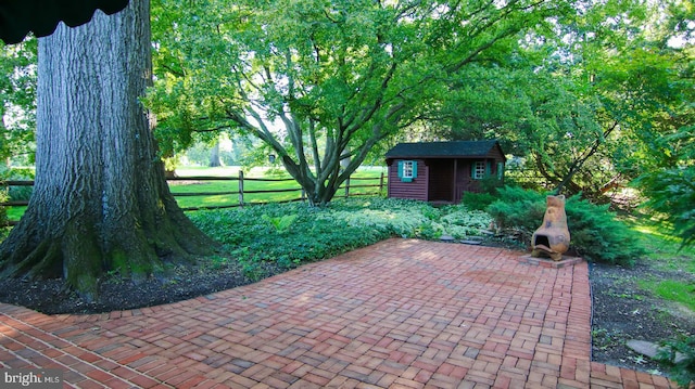 view of patio / terrace featuring a storage unit