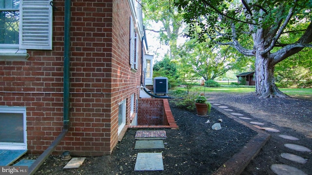 view of side of home featuring central air condition unit